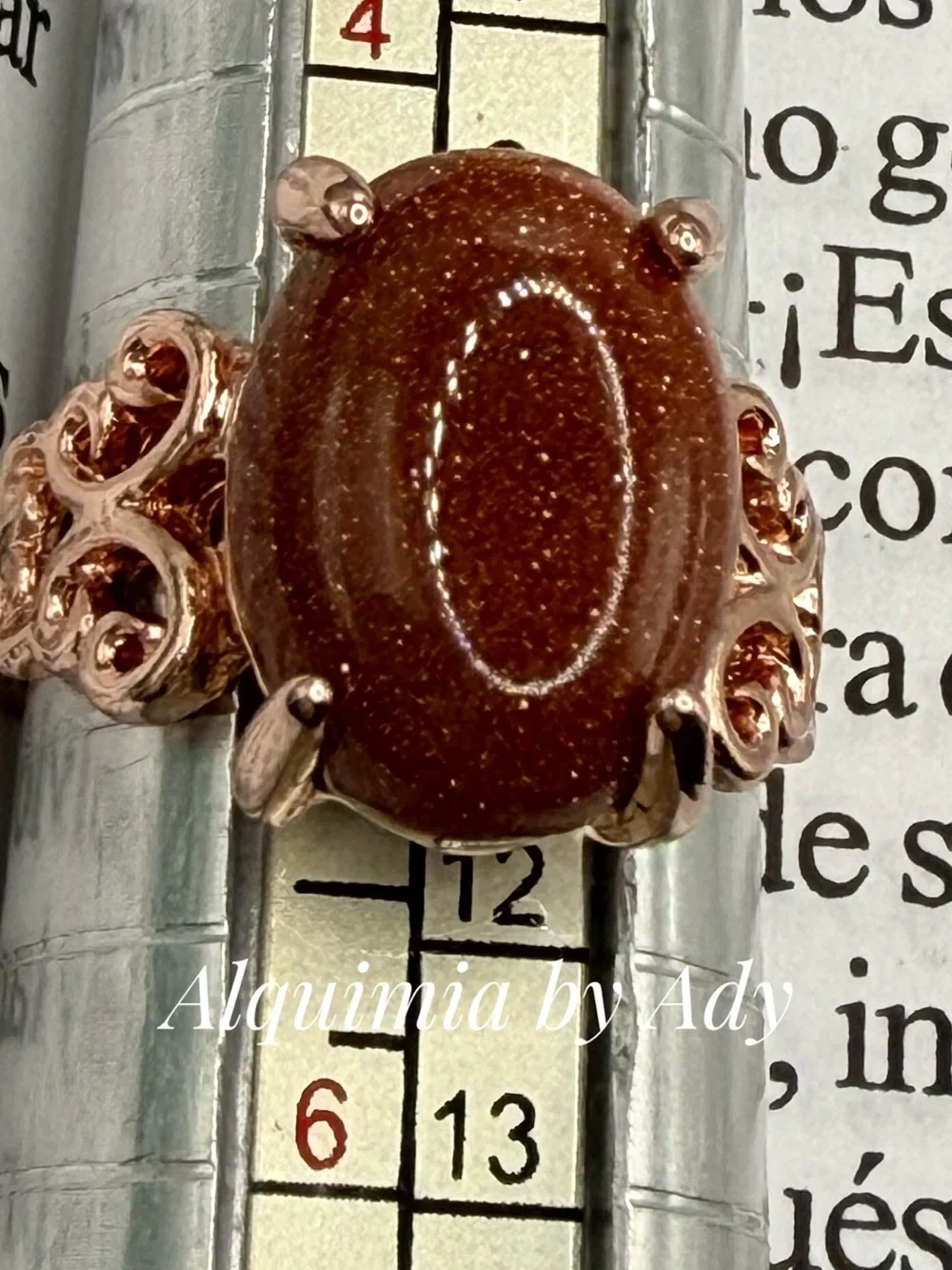 Rose Gold-Tone Ring with Sparkling Brown Goldstone Oval